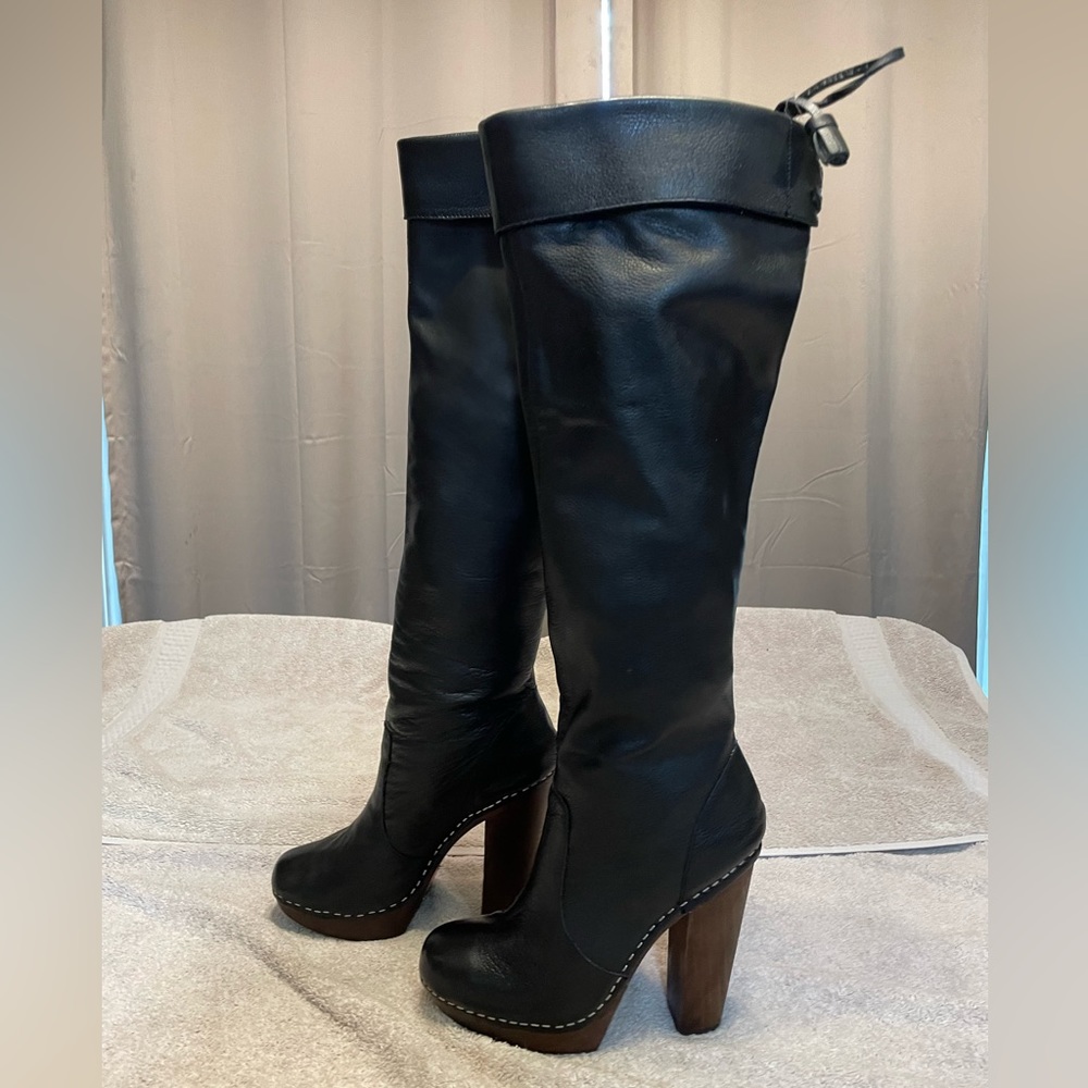 Steve Madden Gwenn leather upper knee high or slouch high heel platform boot.